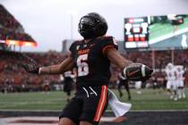 Oregon State running back Damien Martinez (6) celebrates after scoring a touchdown during the f ...