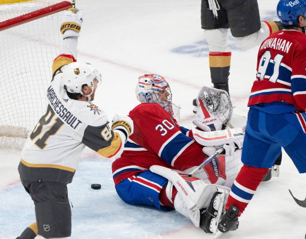 Vegas Golden Knights' Jonathan Marchessault (81) celebrates a goal by Brayden McNabb, not seen, ...