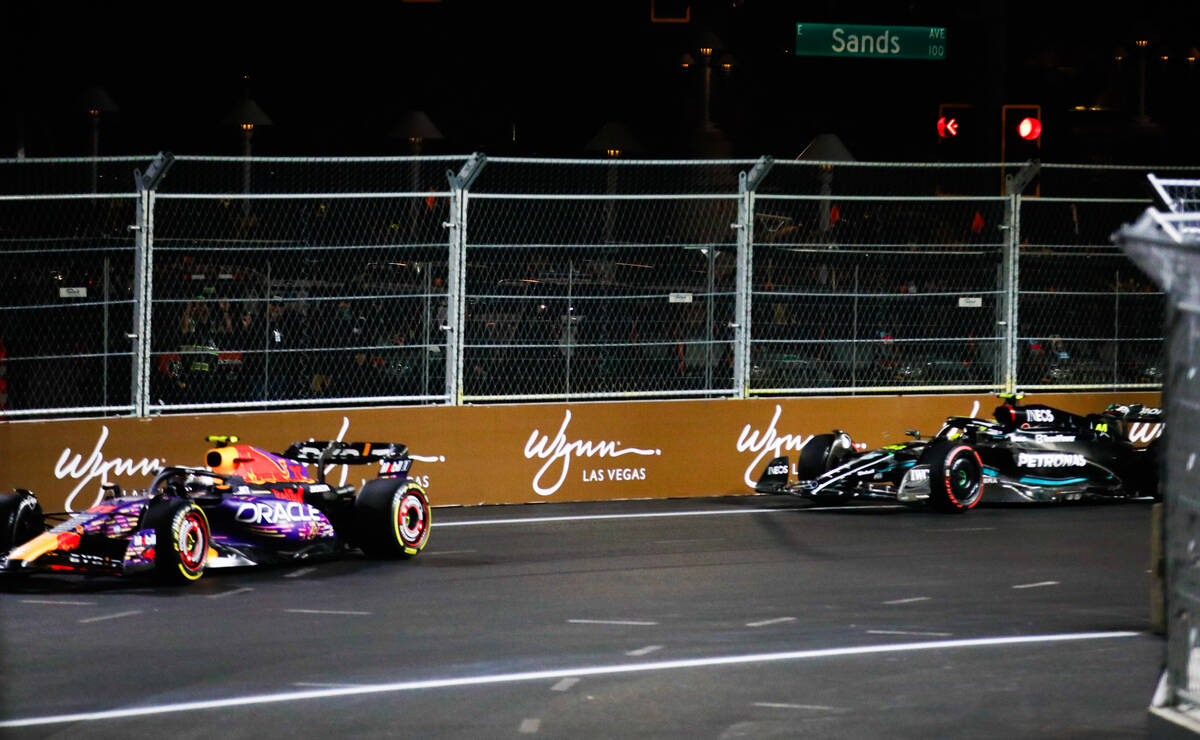 Sergio Perez, left, and Lewis Hamilton race during the first practice session for the Formula 1 ...