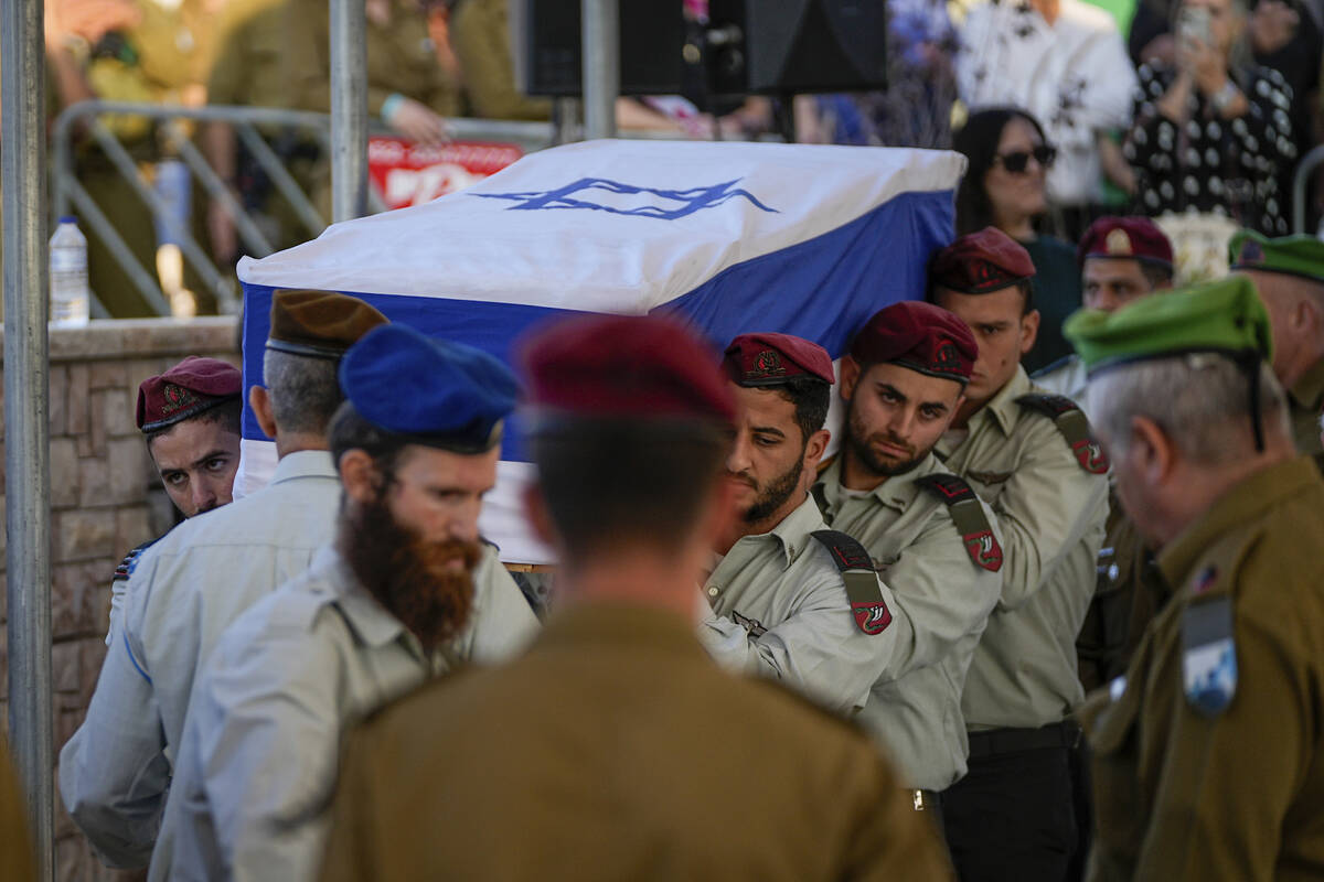 Israeli soldiers carry the flag-draped casket of Israeli soldier Capt. Shlomo Ben Nun, during h ...