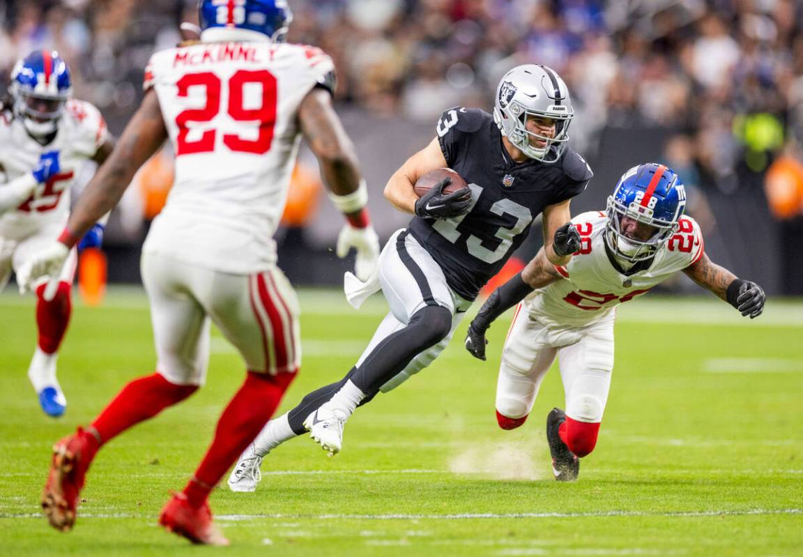 Raiders wide receiver Hunter Renfrow (13) looks for the end zone as New York Giants cornerback ...