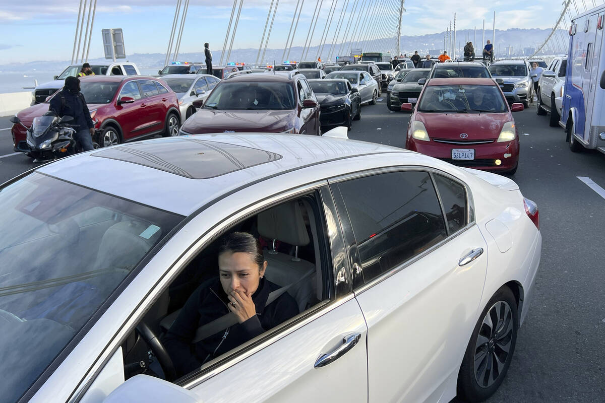 Motorists wait as demonstrators shut down the San Francisco Oakland Bay Bridge in conjunction ...