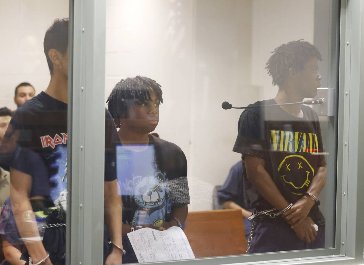 Three of the four juveniles, Damien Hernandez, left, Gianni Robinson, and Dontral Beaver, right ...