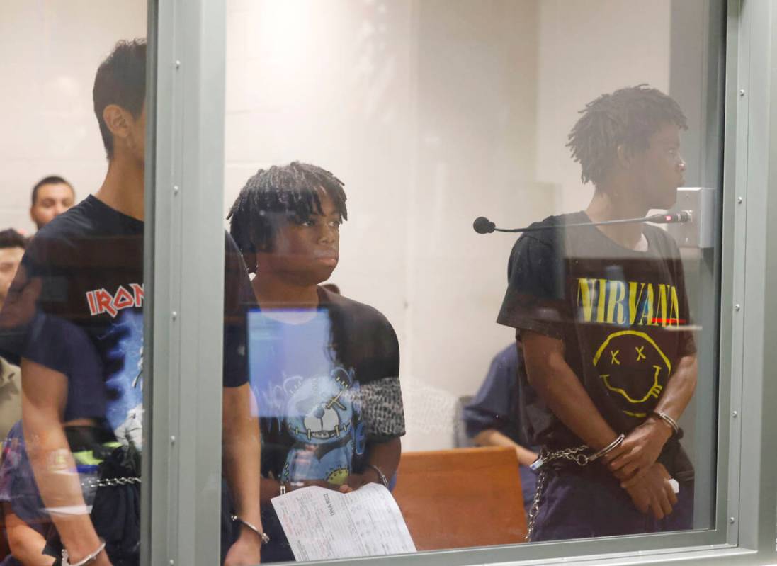 Three of the four juveniles, Damien Hernandez, left, Gianni Robinson, and Dontral Beaver, right ...