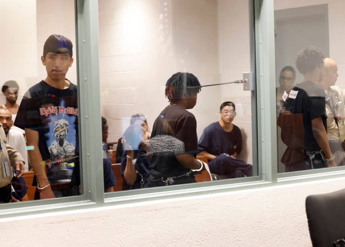 Three of the four juveniles, Damien Hernandez, left, Gianni Robinson, and Dontral Beaver, right ...