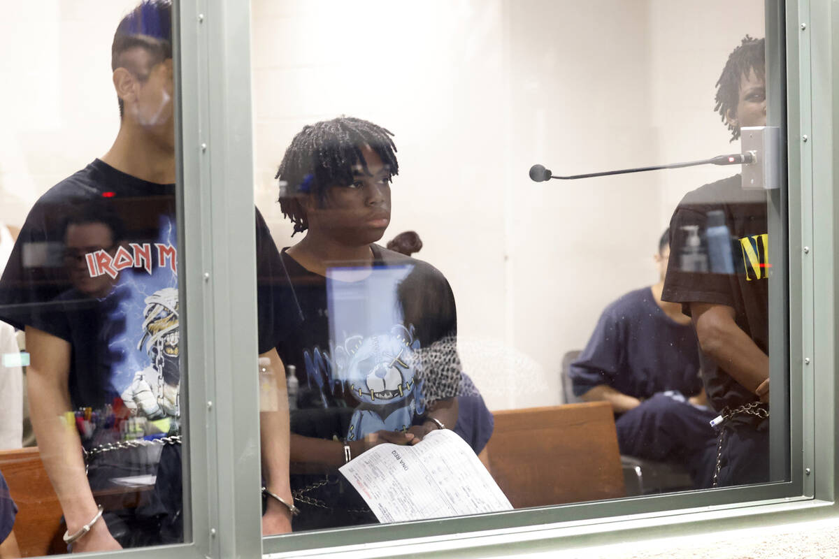 Three of the four juveniles, Damien Hernandez, left, Gianni Robinson, and Dontral Beaver, right ...