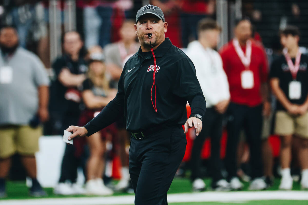 UNLV head coach Barry Odom leads warm ups prior to a game against Colorado State at Allegiant S ...