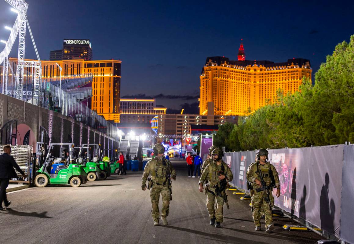 An FBI security detail walks about the pit building during the second night of the Las Vegas Gr ...