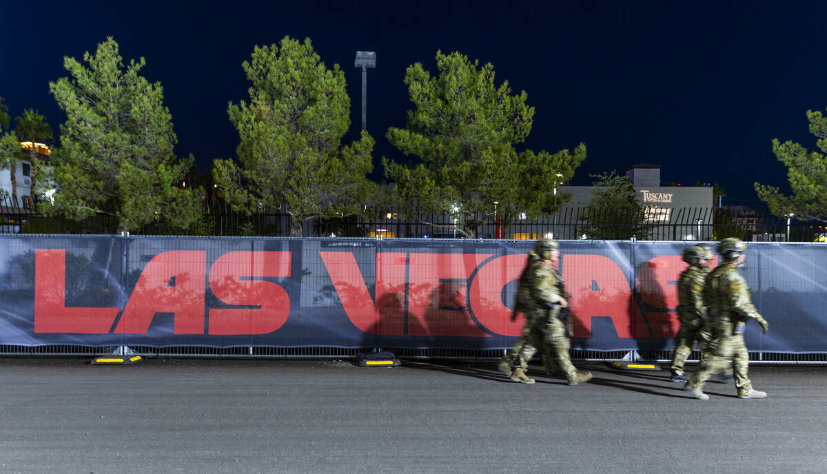 An FBI security detail walks about the pit building during the second night of the Las Vegas Gr ...