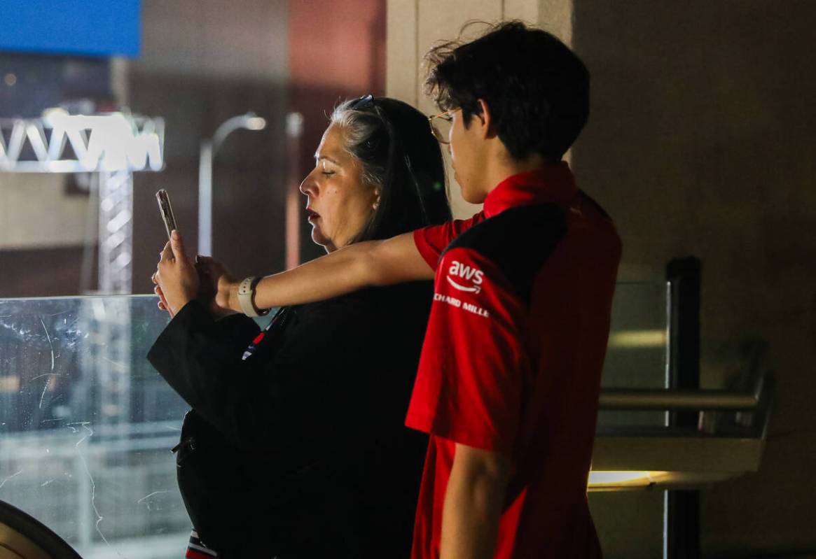 Strip tourists look upon the Formula 1 racetrack prior to the third practice race for the Formu ...