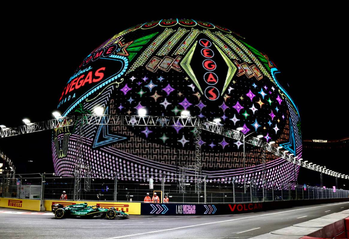 Aston Martin driver Fernando Alonso turns the corner at the MSG Sphere during Friday, Nov. 17, ...