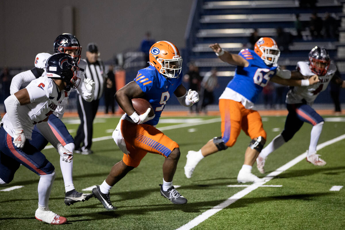 Bishop Gorman tight end Elija Lofton (9) carries the ball up the field against Coronado’ ...