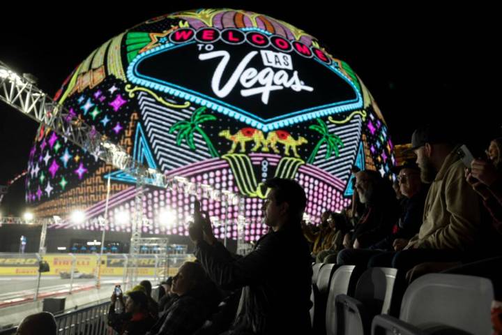 Formula One fans record the third practice for the Las Vegas Grand Prix auto race on Friday, No ...