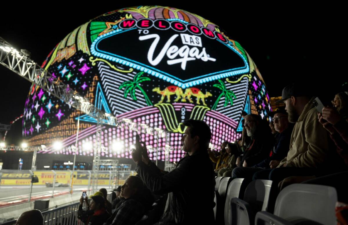 Formula One fans record the third practice for the Las Vegas Grand Prix auto race on Friday, No ...