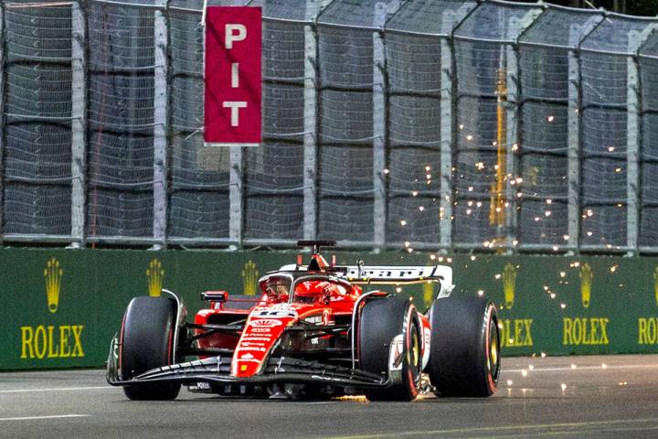 Ferrari driver Charles LeClerc kicks up sparks on the final stretch during the qualifying sessi ...