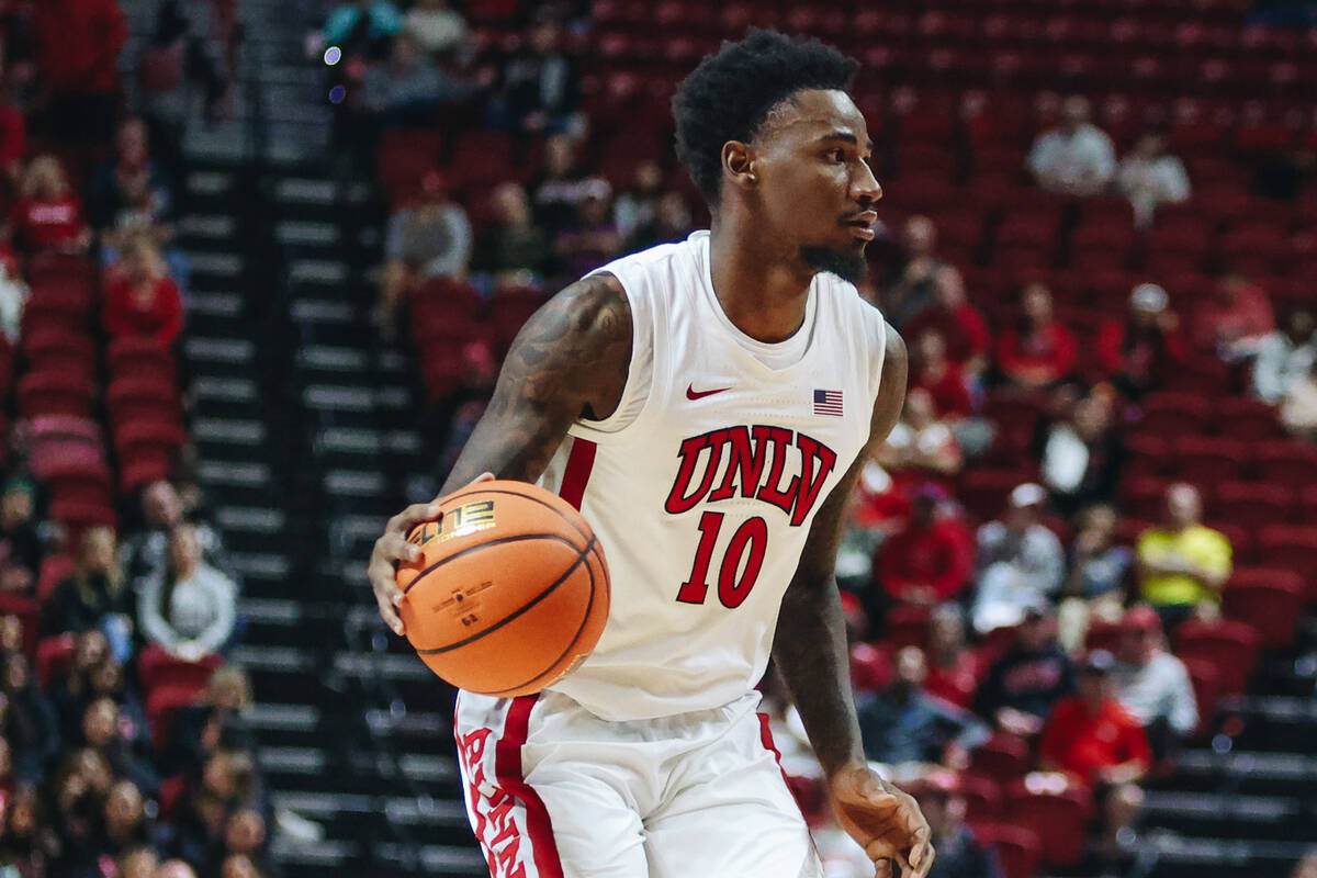 UNLV forward Kalib Boone (10) dribbles the ball during a game against Stetson at Thomas & M ...