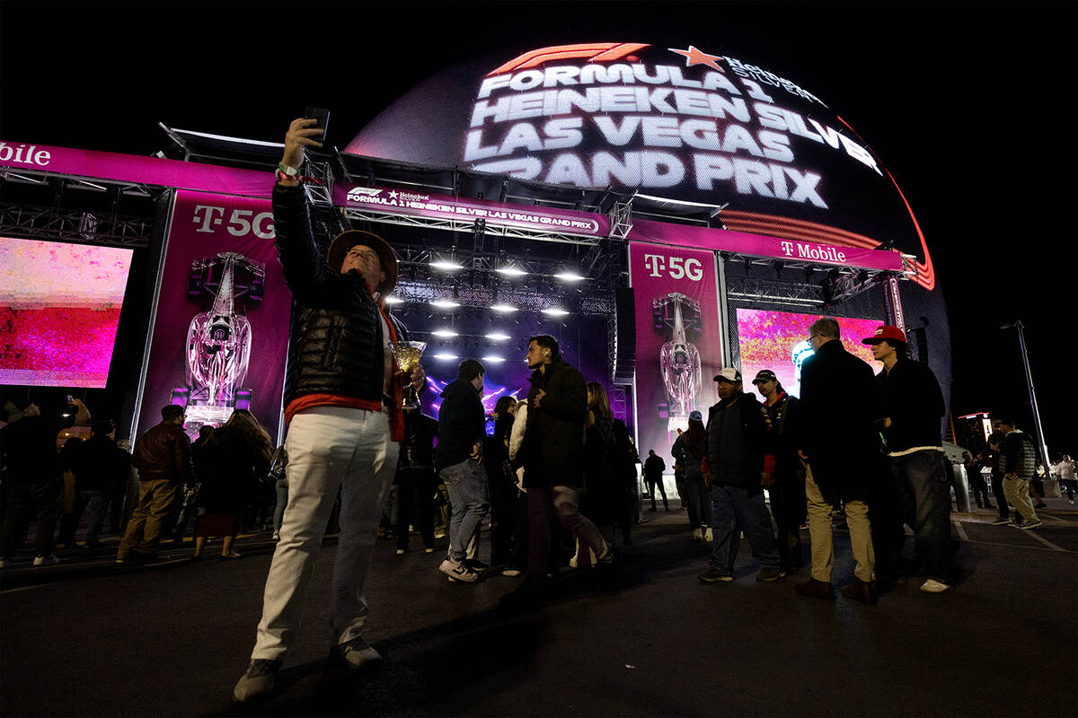 Fans pose in front of the Sphere before the Formula One Las Vegas Grand Prix auto race on Satur ...