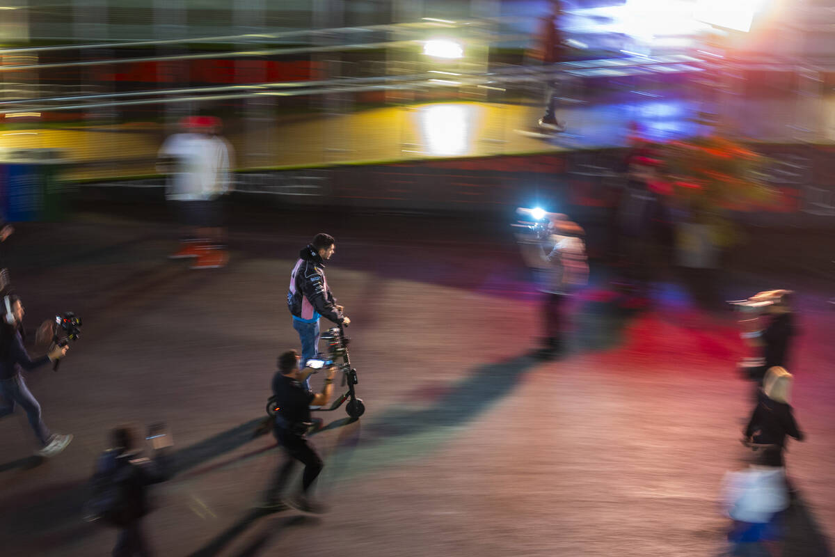 Alpine driver Esteban Ocon speeds through the team area after momentarily stopping on the "red ...