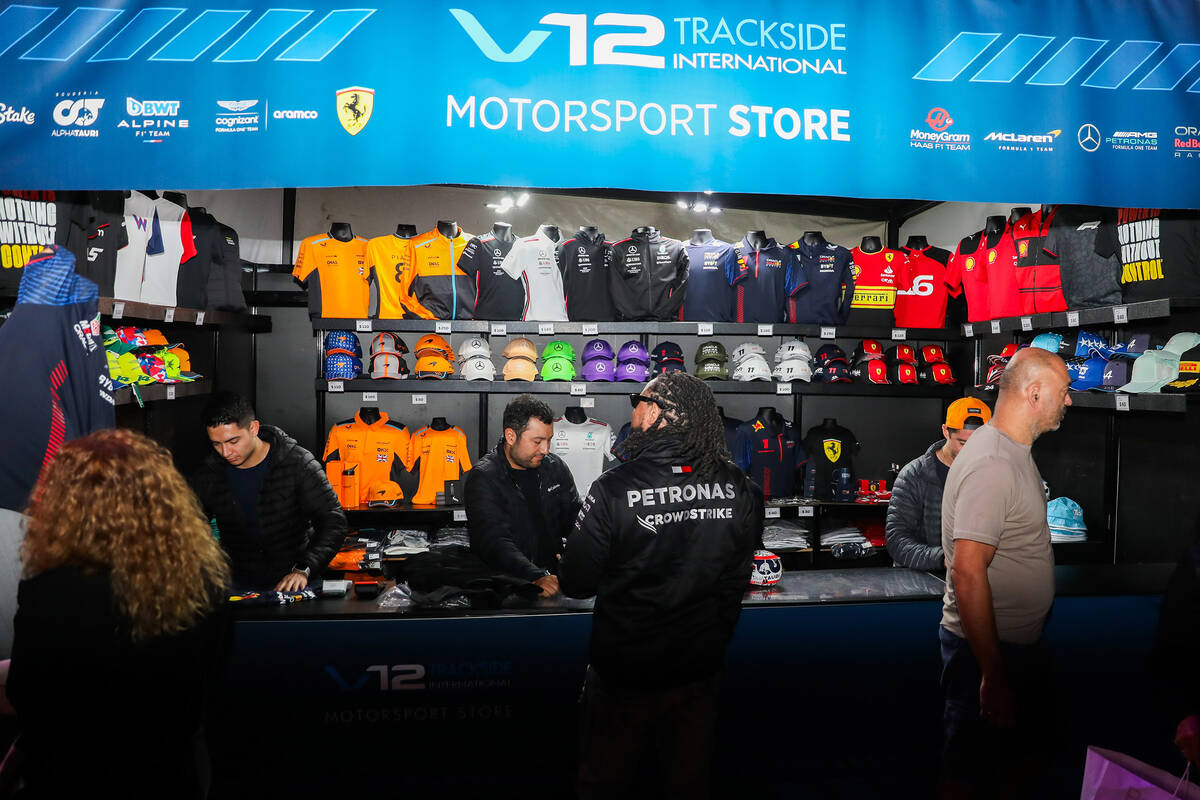 Formula 1 fans shop at a V12 Trackside International Motorsports Store prior to the final Formu ...