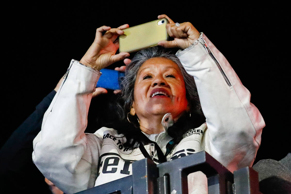 An excited fan takes a picture during the Formula 1 Las Vegas Grand Prix race on Sunday, Nov. 1 ...