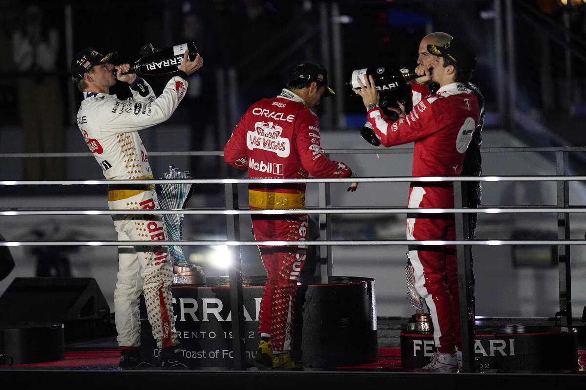 Red Bull driver Max Verstappen, left, of the Netherlands; Red Bull driver Sergio Perez, center, ...