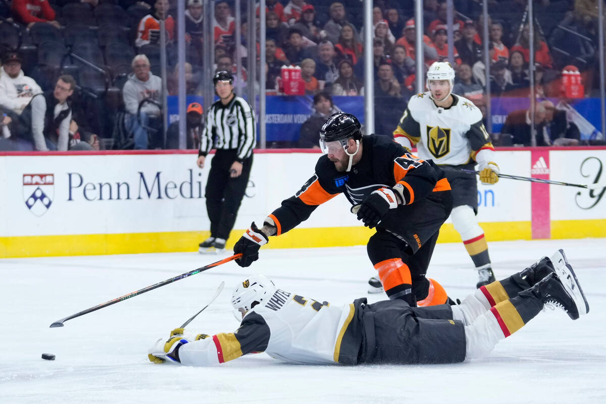 Philadelphia Flyers' Nicolas Deslauriers (44) and Vegas Golden Knights' Zach Whitecloud (2) cha ...