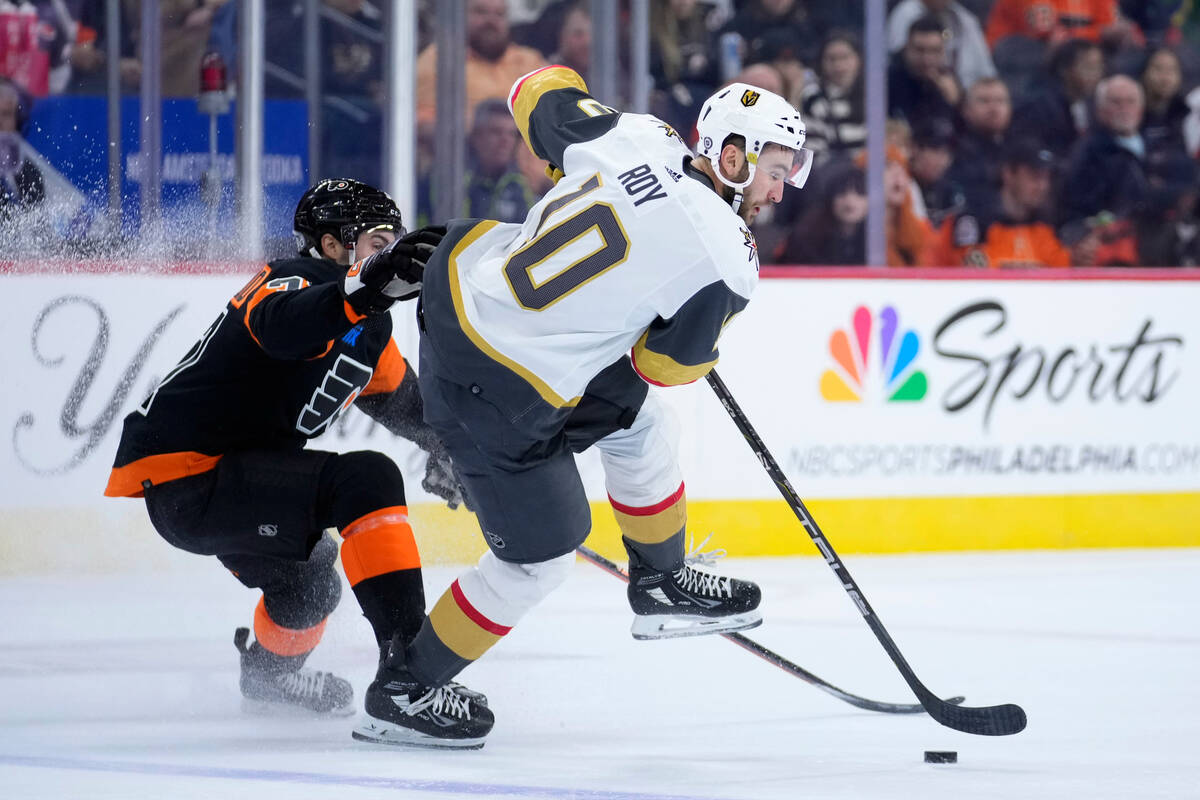 Vegas Golden Knights' Nicolas Roy, right, tries to get past Philadelphia Flyers' Louie Belpedio ...