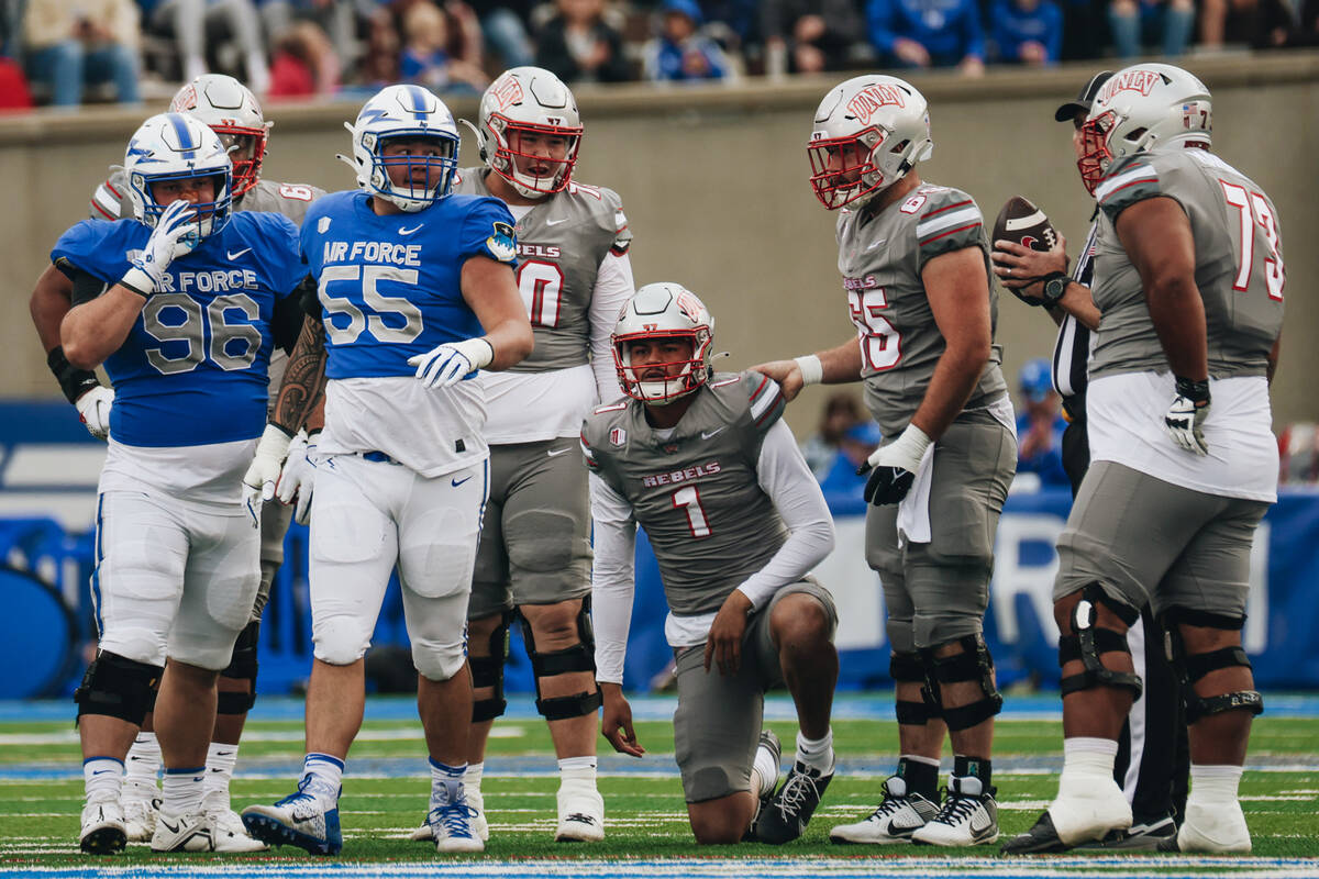 UNLV quarterback Jayden Maiava gets up after being taken down by an Air Force player during a g ...