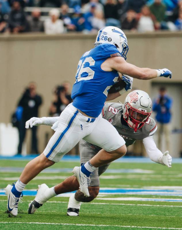 UNLV defensive back Jaxen Turner (2) goes in to tackle Air Force Falcons running back Owen Burk ...