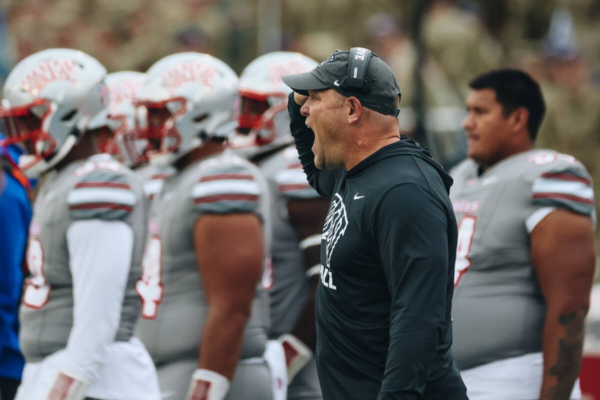 UNLV head coach Barry Odom yells to his team on the field during a game at Falcon Stadium on Sa ...