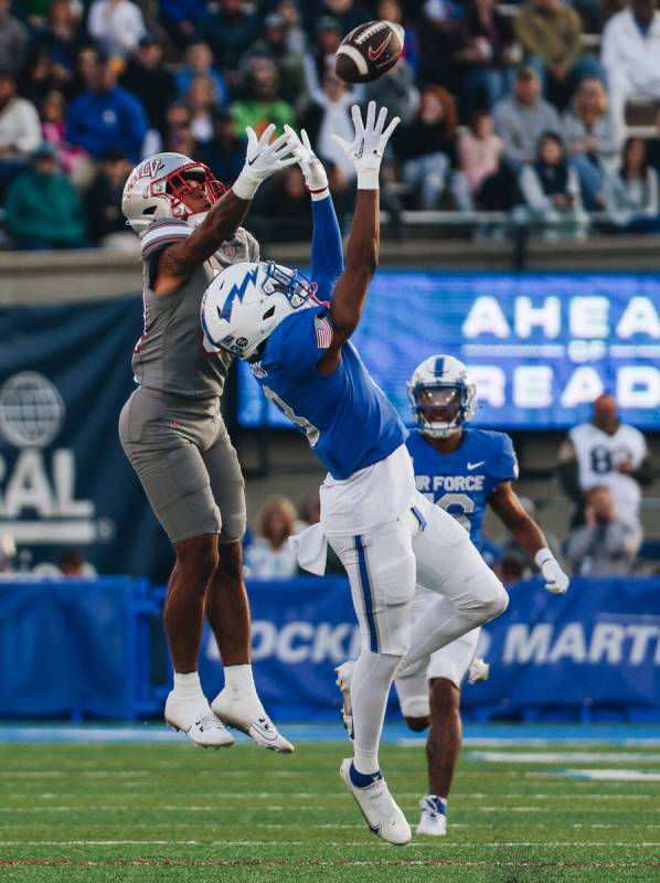 UNLV wide receiver Corey Thompson Jr. (84) reaches to complete a pass from a teammate during a ...