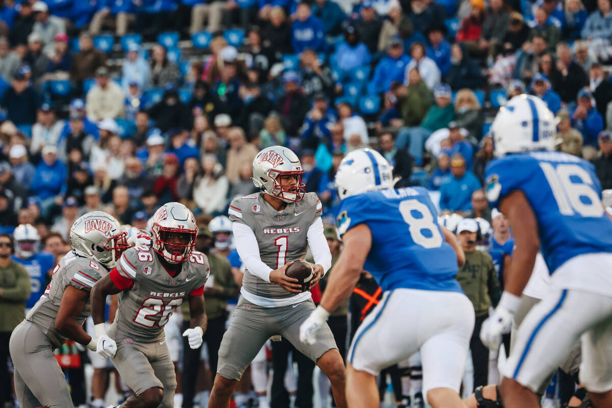 UNLV quarterback Jayden Maiava (1) gets ready to pass the ball onto running back Courtney Reese ...