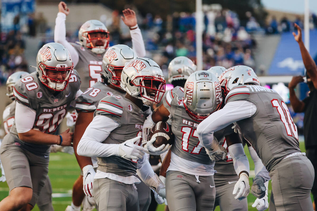 UNLV players celebrate defensive back Kris Williams (17) after a play during a game against Air ...