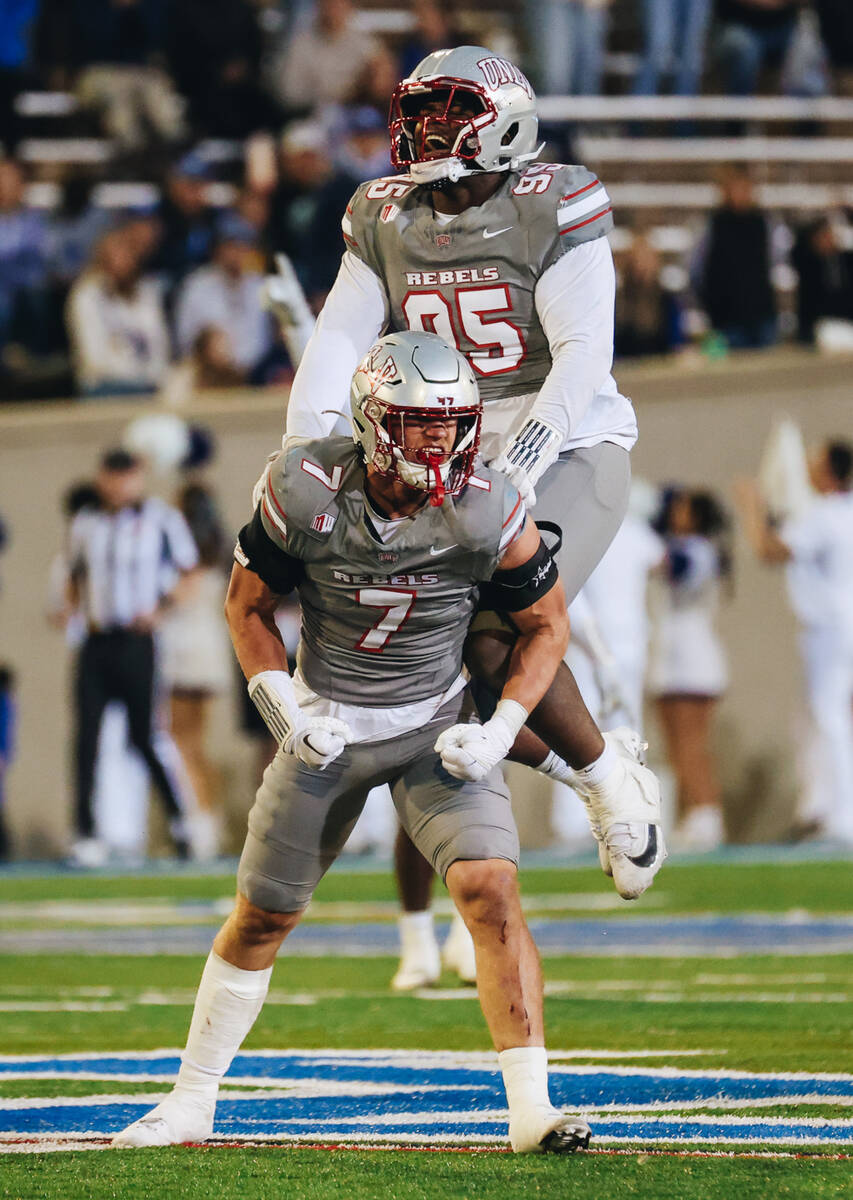 UNLV linebacker Jackson Woodard (7) and UNLV defensive lineman Alexander Whitmore (95) celebrat ...