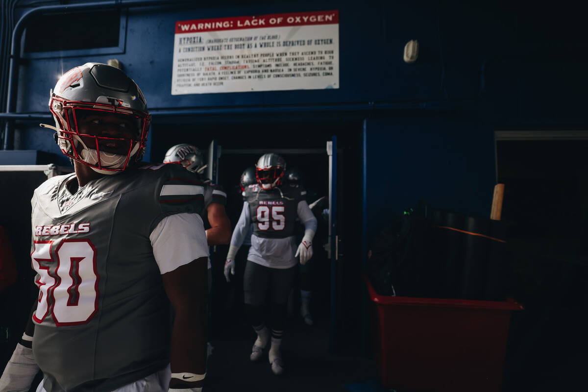 UNLV players take to the field before a game against Air Force at Falcon Stadium on Saturday, N ...