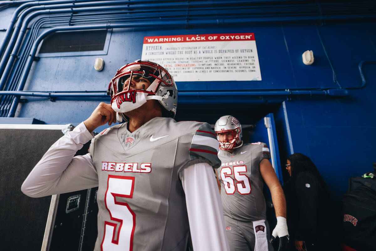 UNLV players take to the field before a game against Air Force at Falcon Stadium on Saturday, N ...