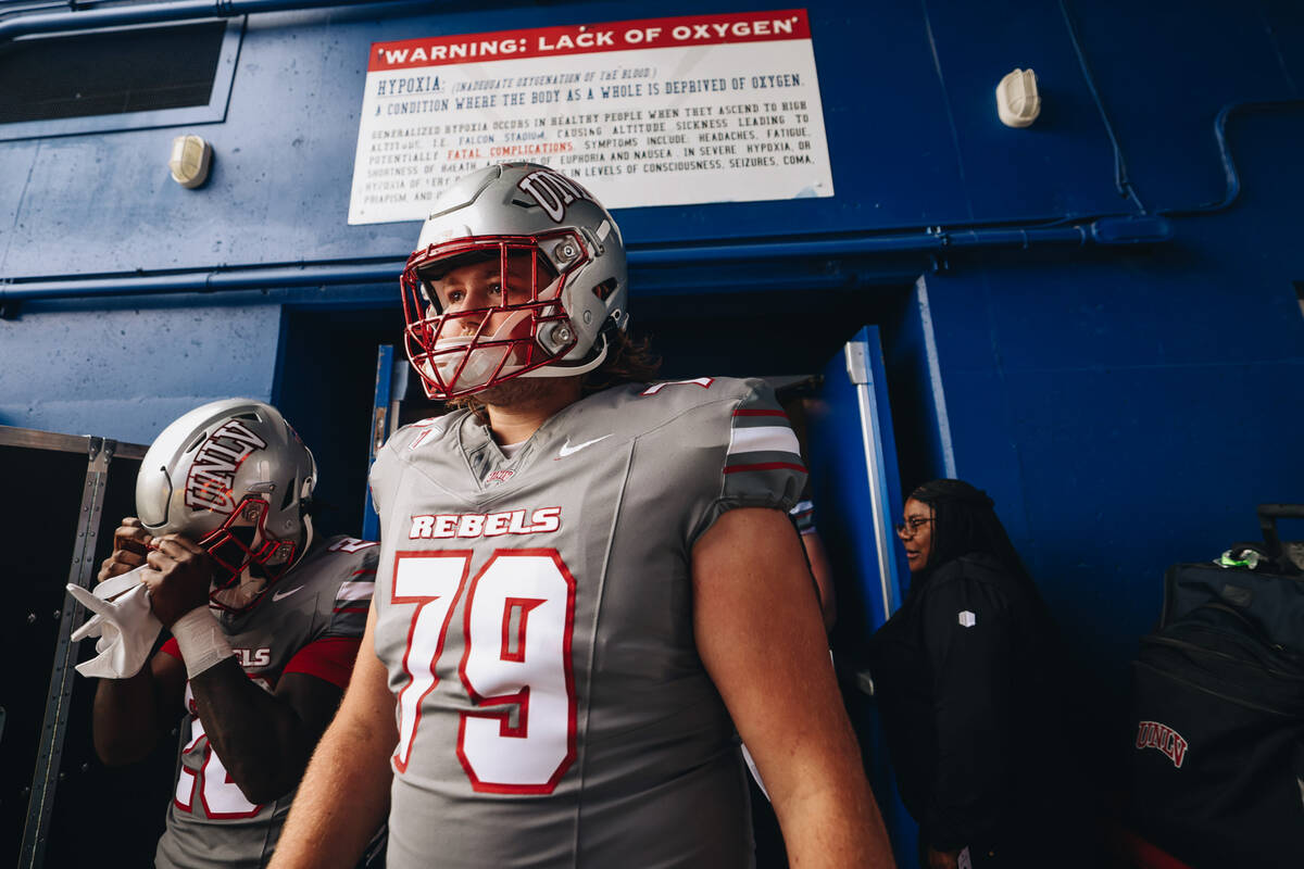 UNLV players take to the field before a game against Air Force at Falcon Stadium on Saturday, N ...