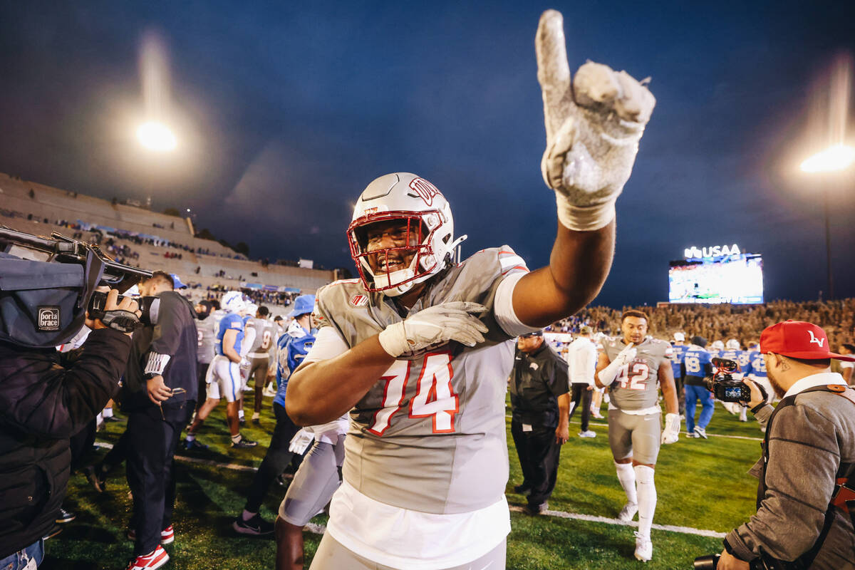 UNLV offensive lineman Jalen St. John (74) celebrates beating Air Force at Falcon Stadium on Sa ...