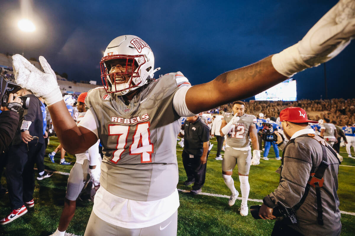 UNLV offensive lineman Jalen St. John (74) celebrates beating Air Force at Falcon Stadium on Sa ...