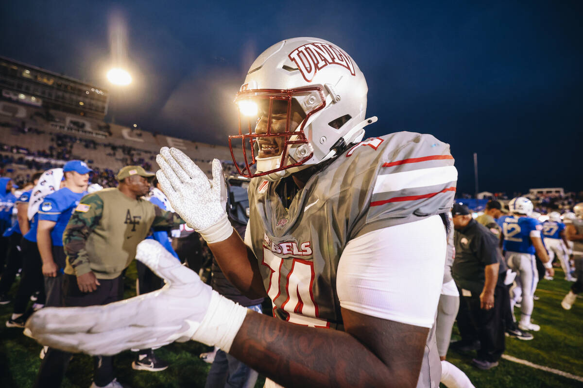 UNLV offensive lineman Jalen St. John (74) celebrates beating Air Force at Falcon Stadium on Sa ...