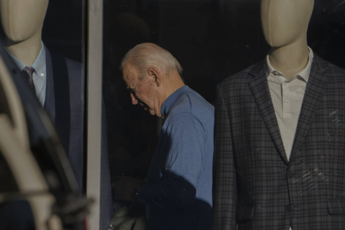 President Joe Biden is seen shopping inside Jos A. Bank in Greenville, Del.,Saturday, Nov. 18, ...