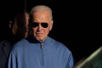 President Joe Biden walks out of Jos A. Bank in Greenville, Del., Saturday, Nov. 18, 2023. (AP ...