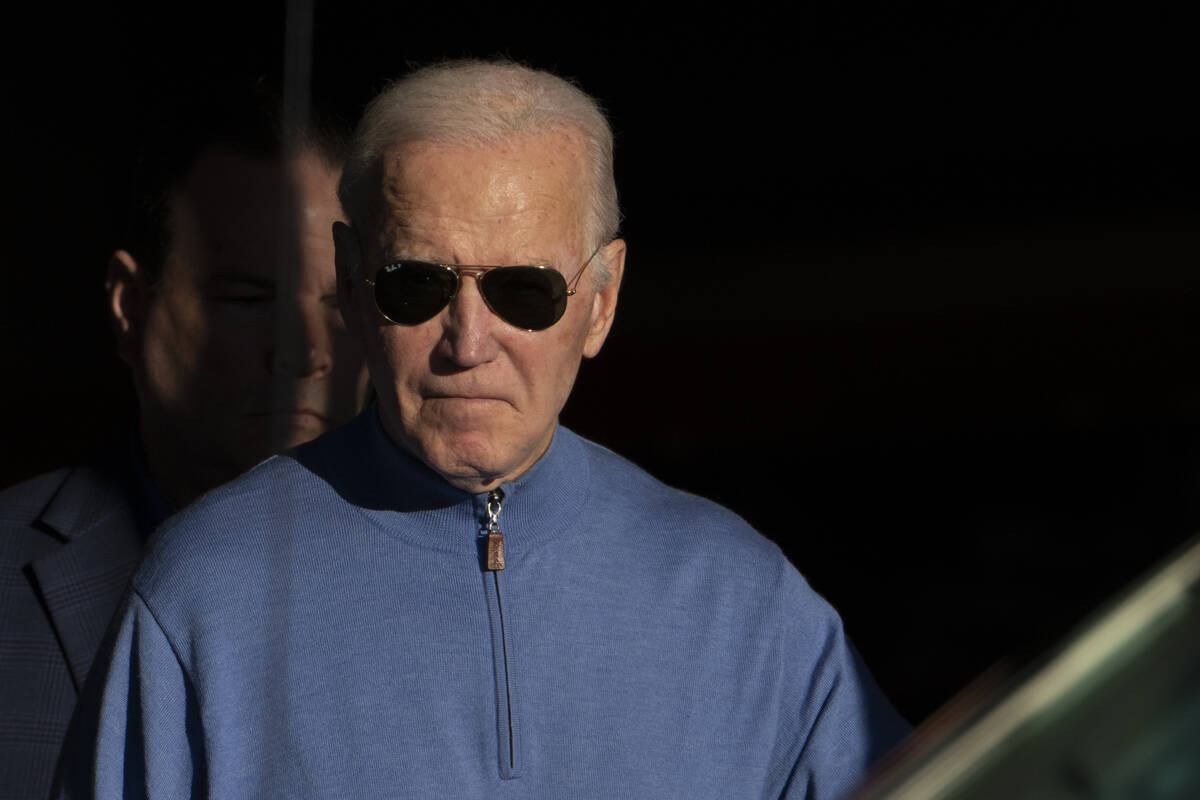 President Joe Biden walks out of Jos A. Bank in Greenville, Del., Saturday, Nov. 18, 2023. (AP ...