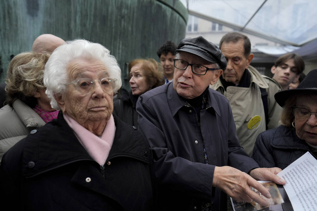 French nazi hunter Serge Klarsfeld, center right, and Auschwitz concentration camp survivor Est ...