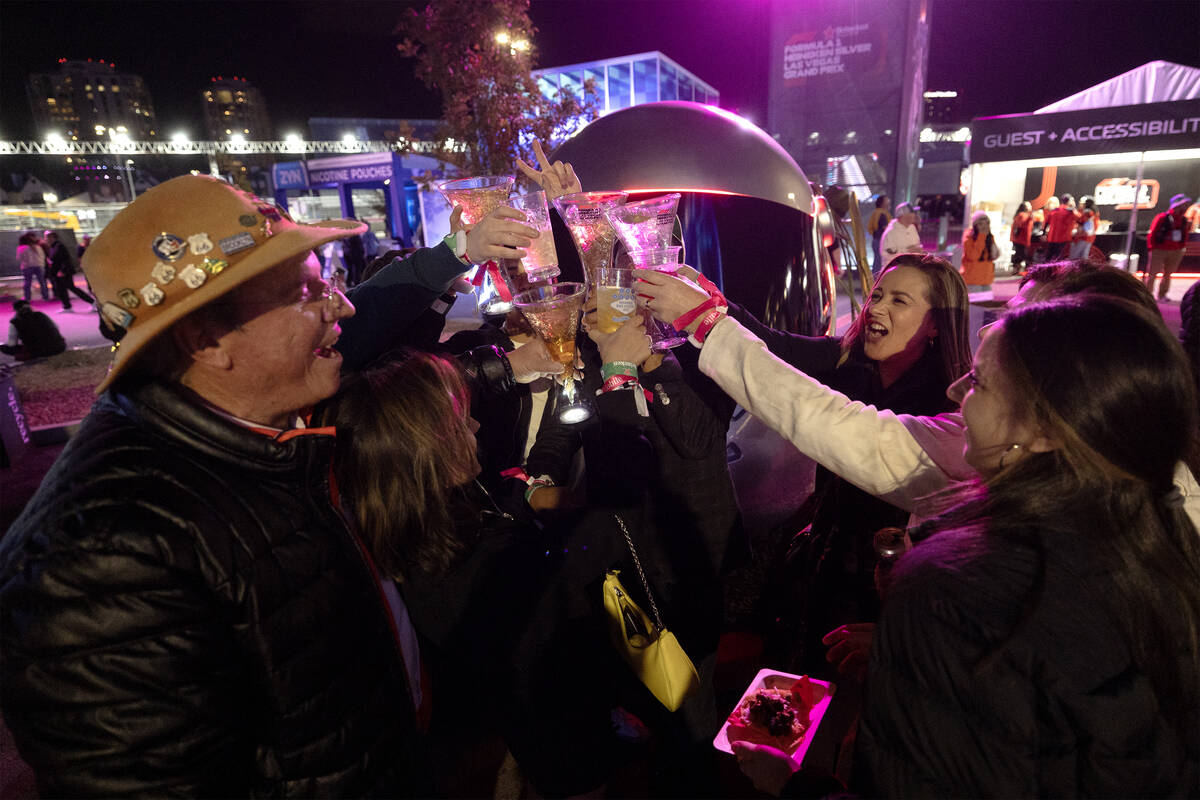 A group from Mexico cheers to the Formula One Las Vegas Grand Prix before the auto race on Satu ...