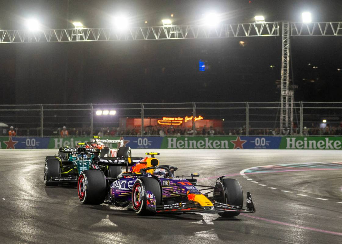 Red Bull Racing driver Sergio Perez leads Aston Martin driver Fernando Alonso during the Las Ve ...