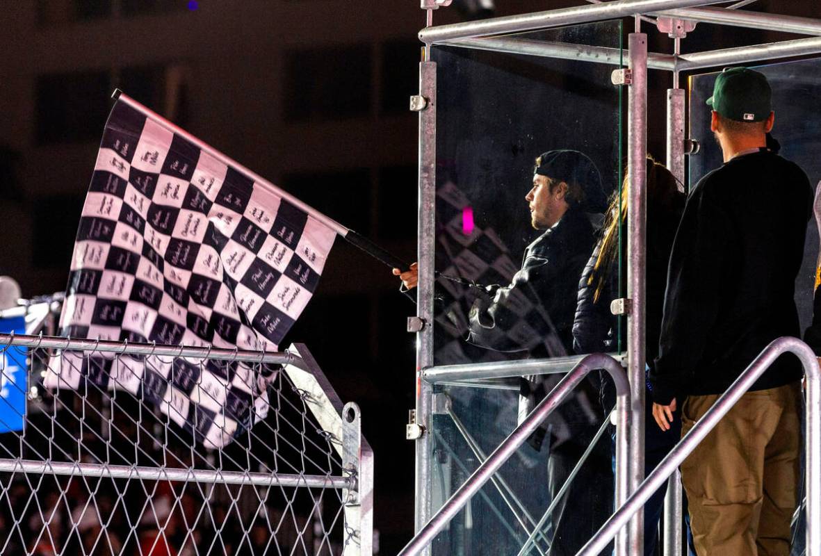 Justin Bieber waves the checkered flag at the end of the race during the Las Vegas Grand Prix F ...