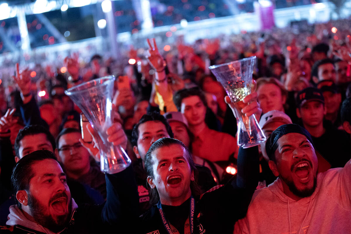 Fans sing along to J Balvin’s performance before the Formula One Las Vegas Grand Prix au ...