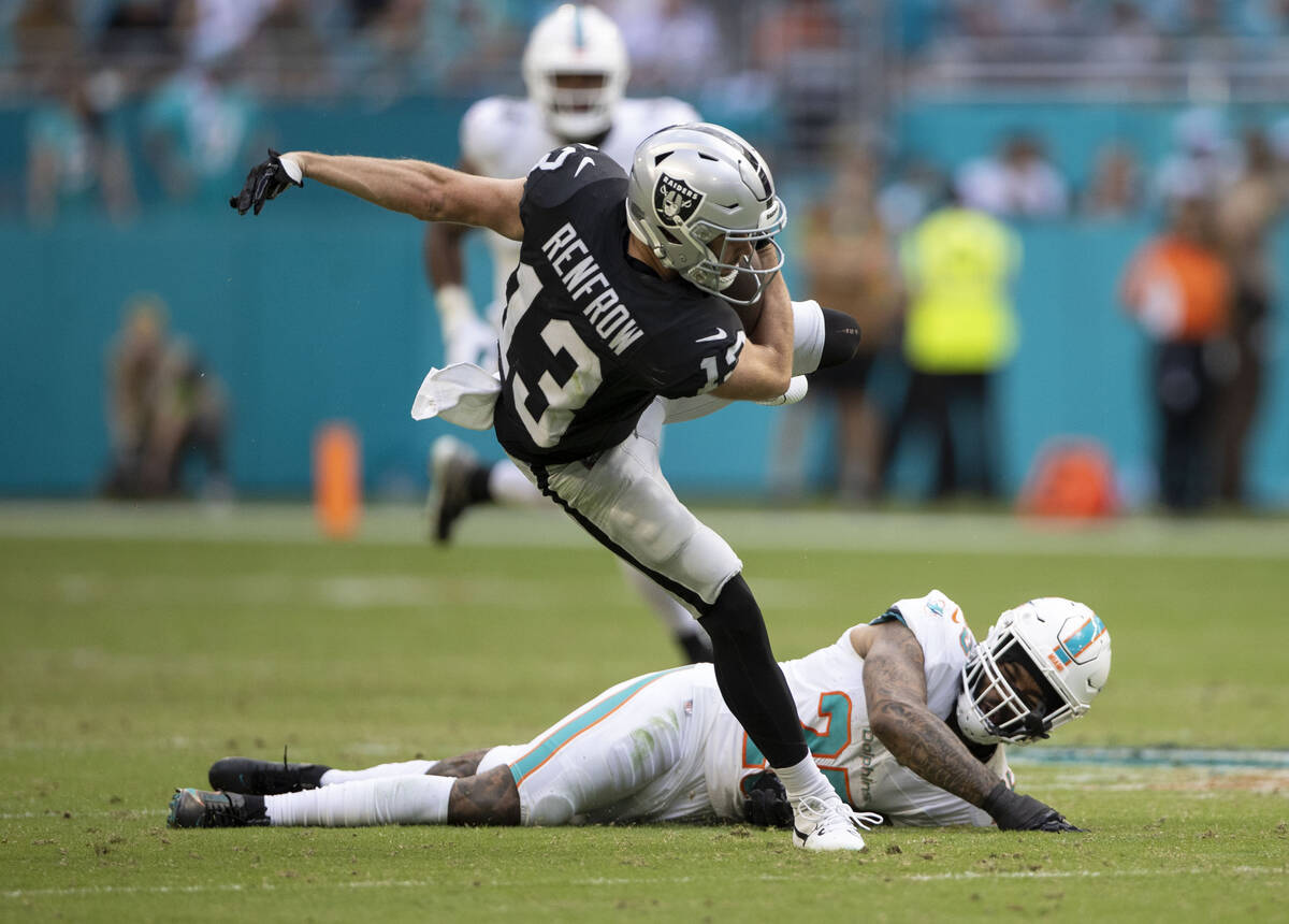 Raiders wide receiver Hunter Renfrow (13) makes a catch and balances to get more yards as Miami ...