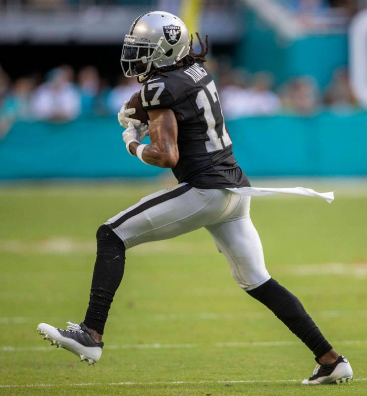 Raiders wide receiver Davante Adams (17) makes a catch against the Miami Dolphins during the se ...